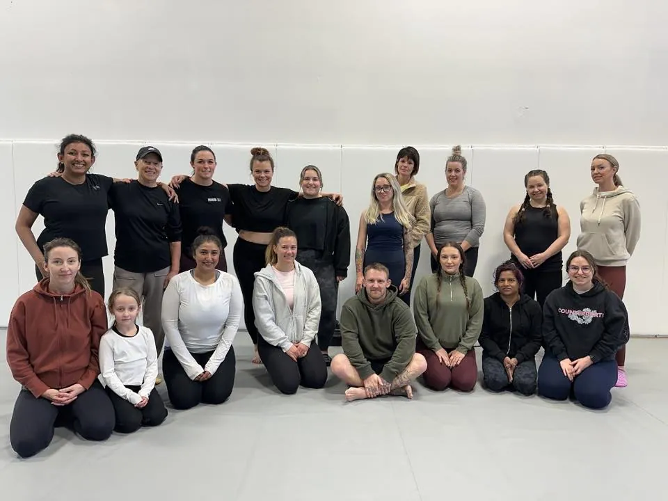 Members of the ladies only program gathered on the mats at Mission BJJ